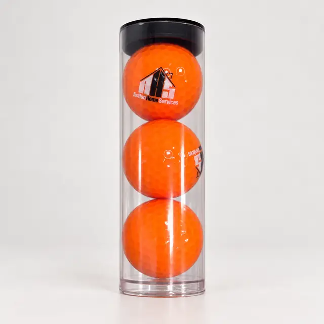 Three orange logo golf balls in a clear cylindrical tube